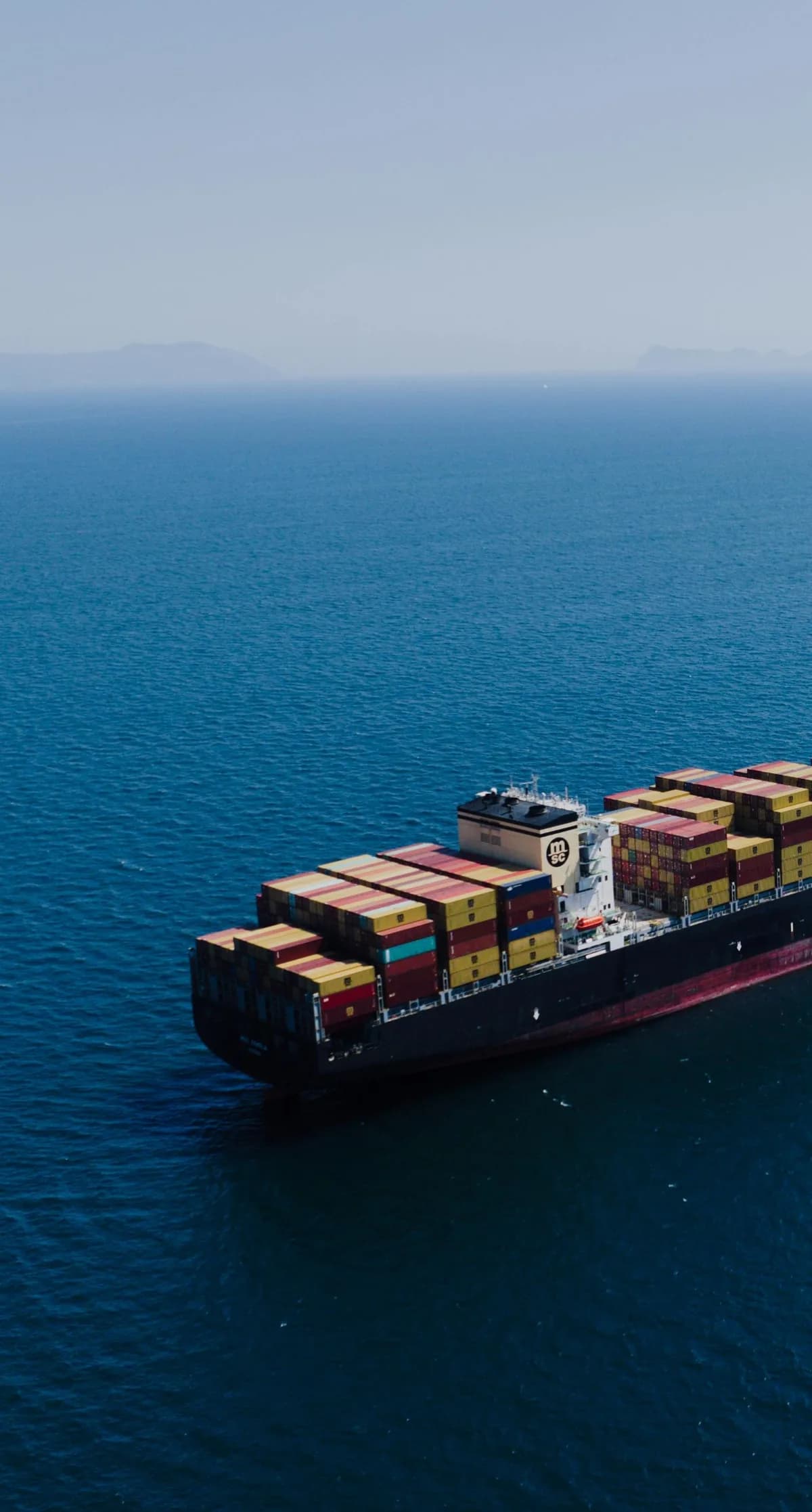Loaded cargo ship at sea